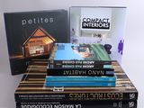 several books are stacked on top of each other on a table