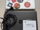 a laptop with a lot of stickers on it