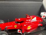 a model of a ferrari racing car in a display case