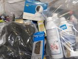 many items that are in a plastic bag on the floor