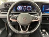 the interior of a car with a steering wheel and dashboard controls