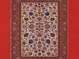 un tapis oriental à fond rouge et à motifs floraux