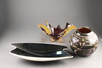 two bowls and a vase sitting on a table
