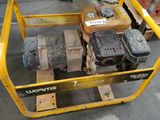 a yellow cart that has a small engine on it