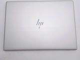the back of a laptop computer sitting on top of a white table