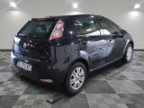 a picture of a small black car parked in a garage