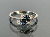 an image of a ring with blue and white diamonds