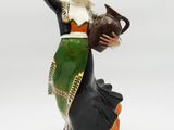figurine of a woman holding a pot and a jug