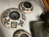 many different types of pottery on the table