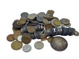 a pile of coins and a coin purse on a white background