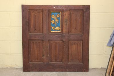 a wooden door with a blue and gold design on it