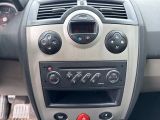 a car dashboard with a clock and radio in it