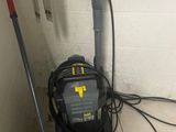 a vacuum and a mop on the floor next to a bucket