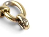 an image of a close up of a gold chain on a white background