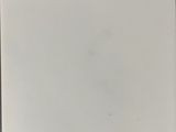 a white piece of paper with writing on it sitting on top of a table