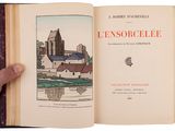 a hand holding an open book with a picture of a castle in the background