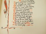 an open book with a drawing of a letter in the middle of it