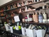 many bottles of hair products on the shelves in the store