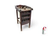 a small wooden table with a drawer on top of it