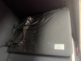 a laptop computer sitting on top of a metal box