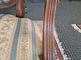 an image of a chair in a room with a rug on the floor