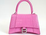 a pink handbag on a white background