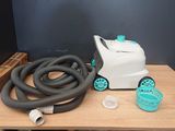 a picture of a table with a blow dryer and a hose