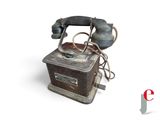 an old telephone that is sitting on top of a table