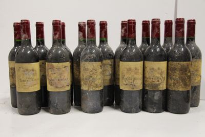six bottles of wine are lined up in a row on a table