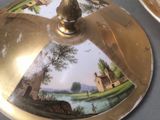 a plate with a picture on it sitting on a table