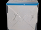 a white box with a design on it on a black background