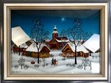 tableau encadré représentant un village enneigé avec une église en arrière-plan