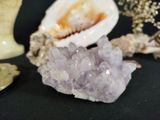a small piece of amethorate sitting on a table next to other items