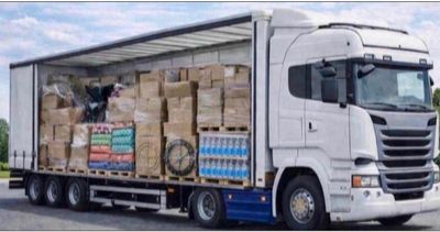 a truck with a trailer full of boxes on the back