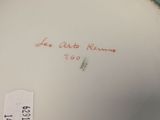 a white and green plate with writing on it on a table