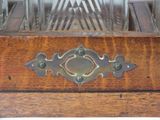 a wooden box that has a metal handle on it