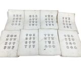 six old chinese books with chinese writing on them on a white surface