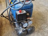 a blue machine that is sitting on the floor