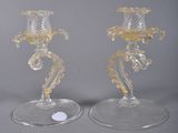 pair of clear glass candlesticks with yellow flowers on them
