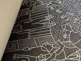 a black and white drawing on the floor of a room