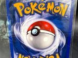 a plastic box with a pokemon figure inside of it