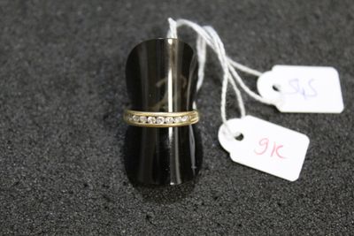 a ring that is sitting on top of a black object