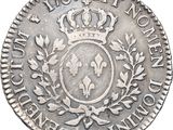 a silver coin with a crown on top of it