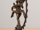 an image of a bronze statue of a man holding a sword