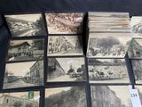 several old black and white photographs of people and vehicles