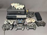 many video game controllers that are sitting on a table