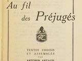 an old book with a picture of a person sitting on top of it