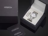 a box with a watch inside of it on a table