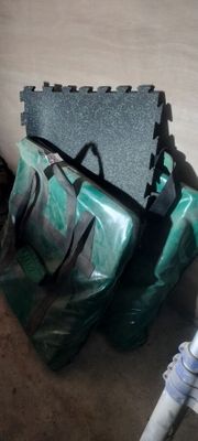 a bag of luggage sitting on the floor next to a pipe