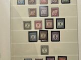 a picture of a framed picture of stamps on a wall